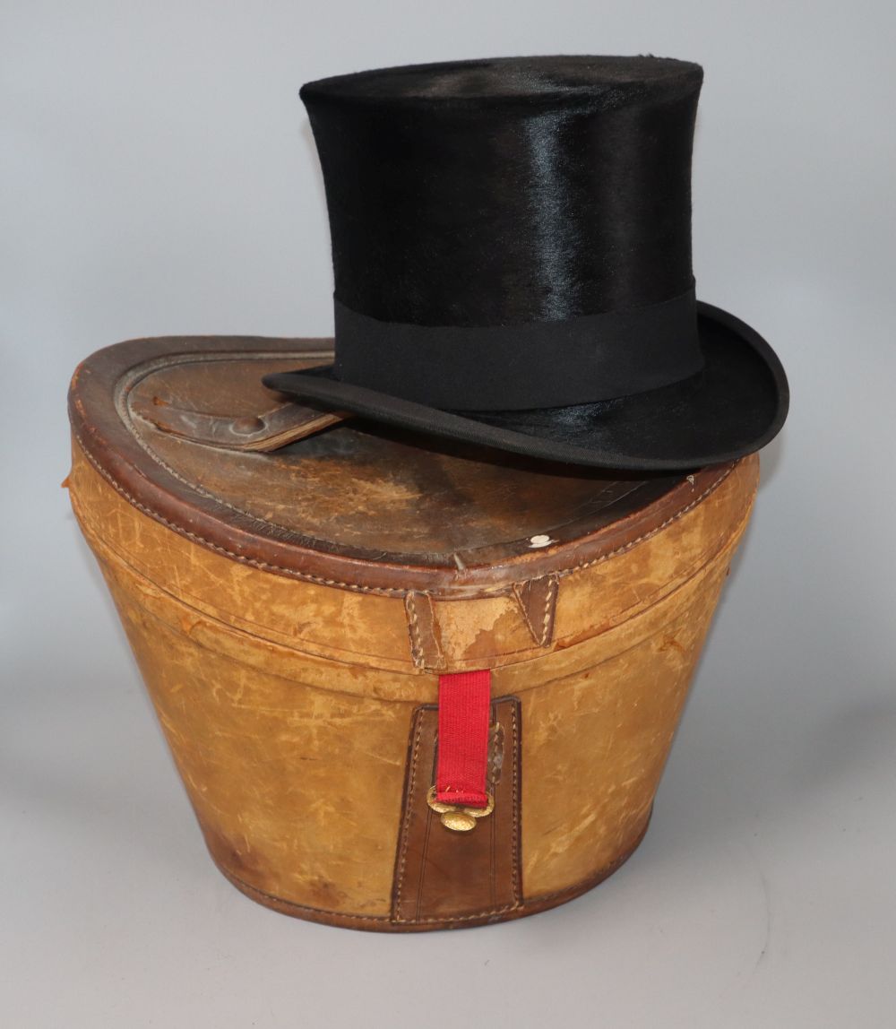 A moleskin top hat in a leather box by Christys London, J. Norton, Haywards Heath, Internal dimensions 15 x 19cm